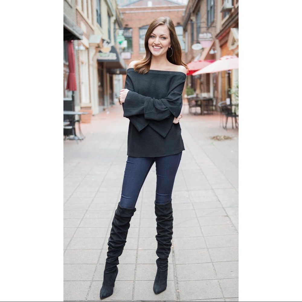 Off the shoulder black sweater w/ dramatic sleeve